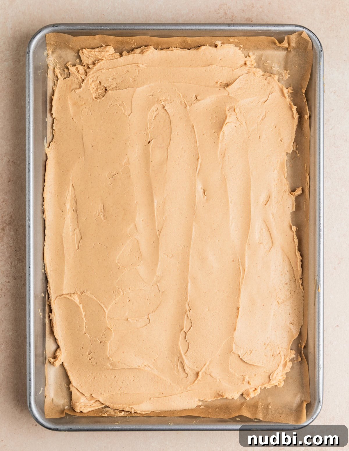 Creamy Greek Yogurt Bark Recipe with Fruit and Honey Toppings 6 Peanut butter and Greek yogurt mixture spread onto parchment lined baking sheet.