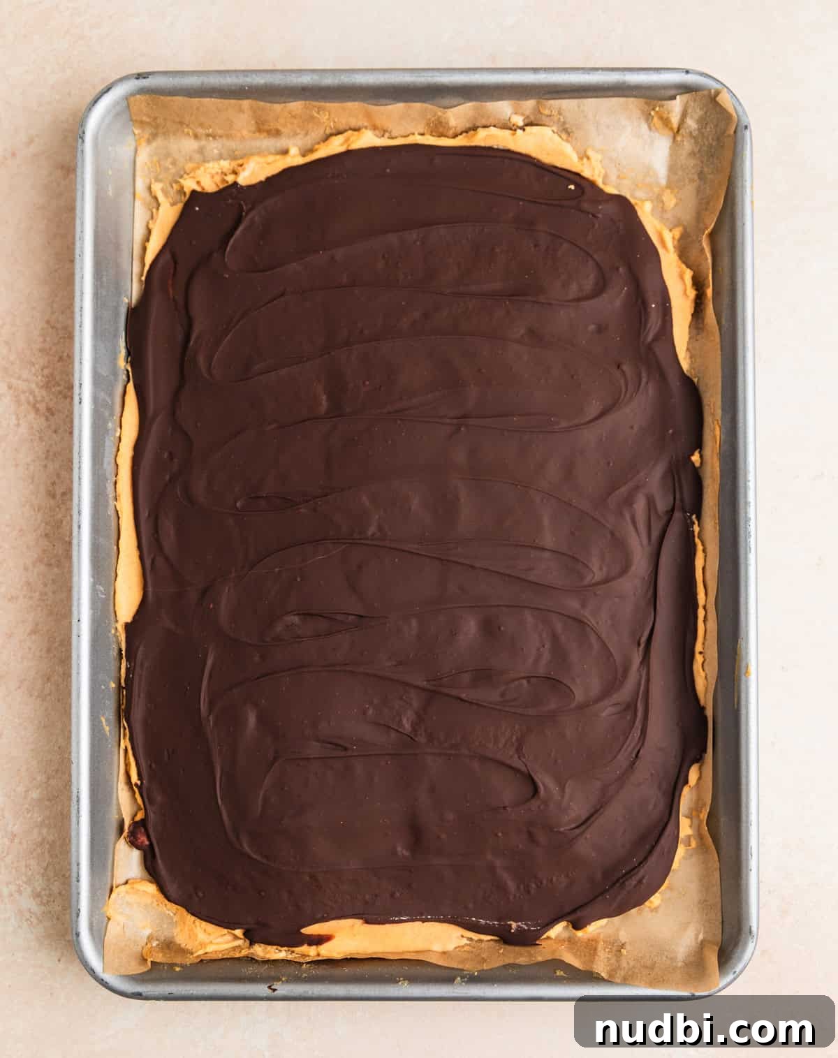 Creamy Greek Yogurt Bark Recipe with Fruit and Honey Toppings 8 Frozen peanut butter dark chocolate Greek yogurt bark on sheet pan.
