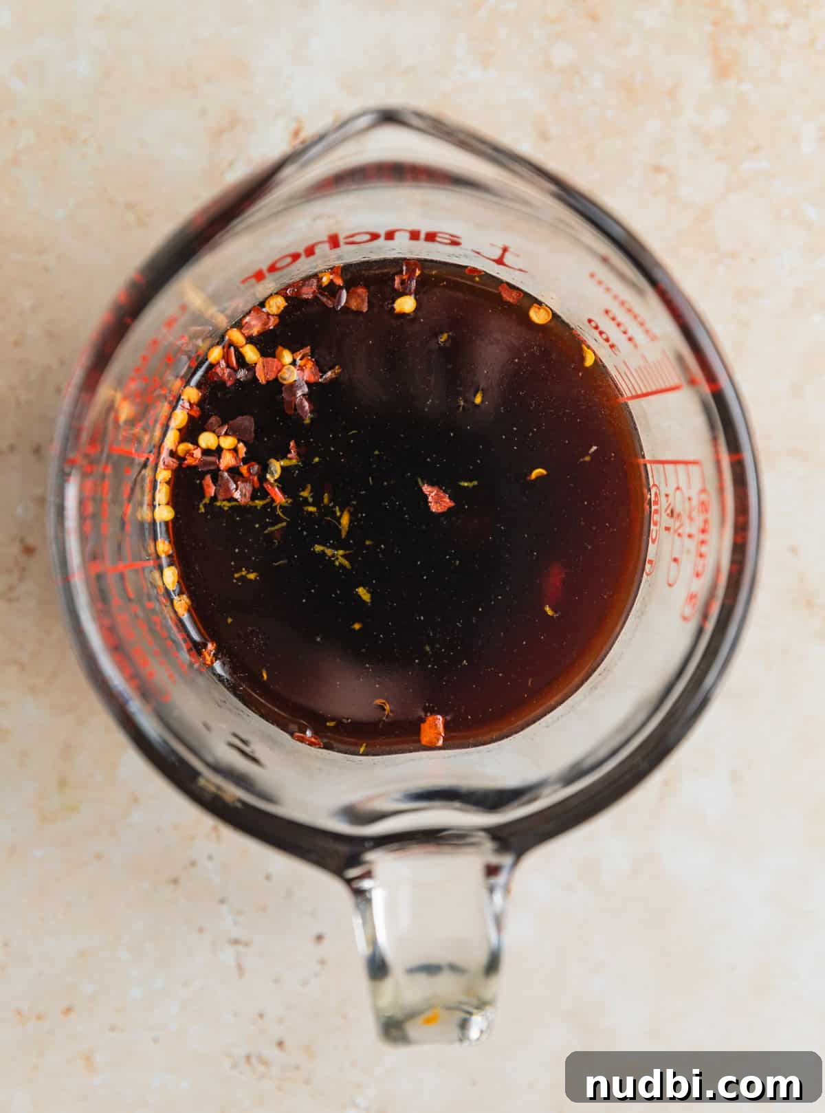 Teriyaki sauce ingredients in measuring cup before whisking together.