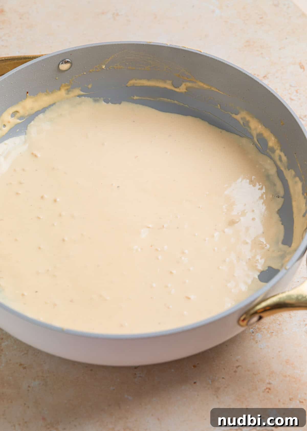 Creamy Skillet Lemon Chicken Recipe for Quick Weeknight Meals 6 Cream cheese sauce in skillet.