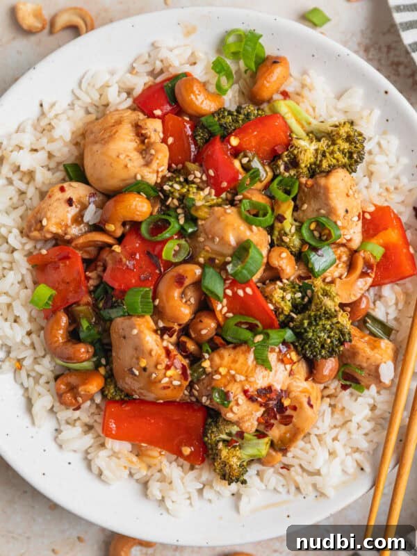 Creamy Skillet Lemon Chicken Recipe for Quick Weeknight Meals 10 Baked cashew chicken over rice on plate with chopsticks.