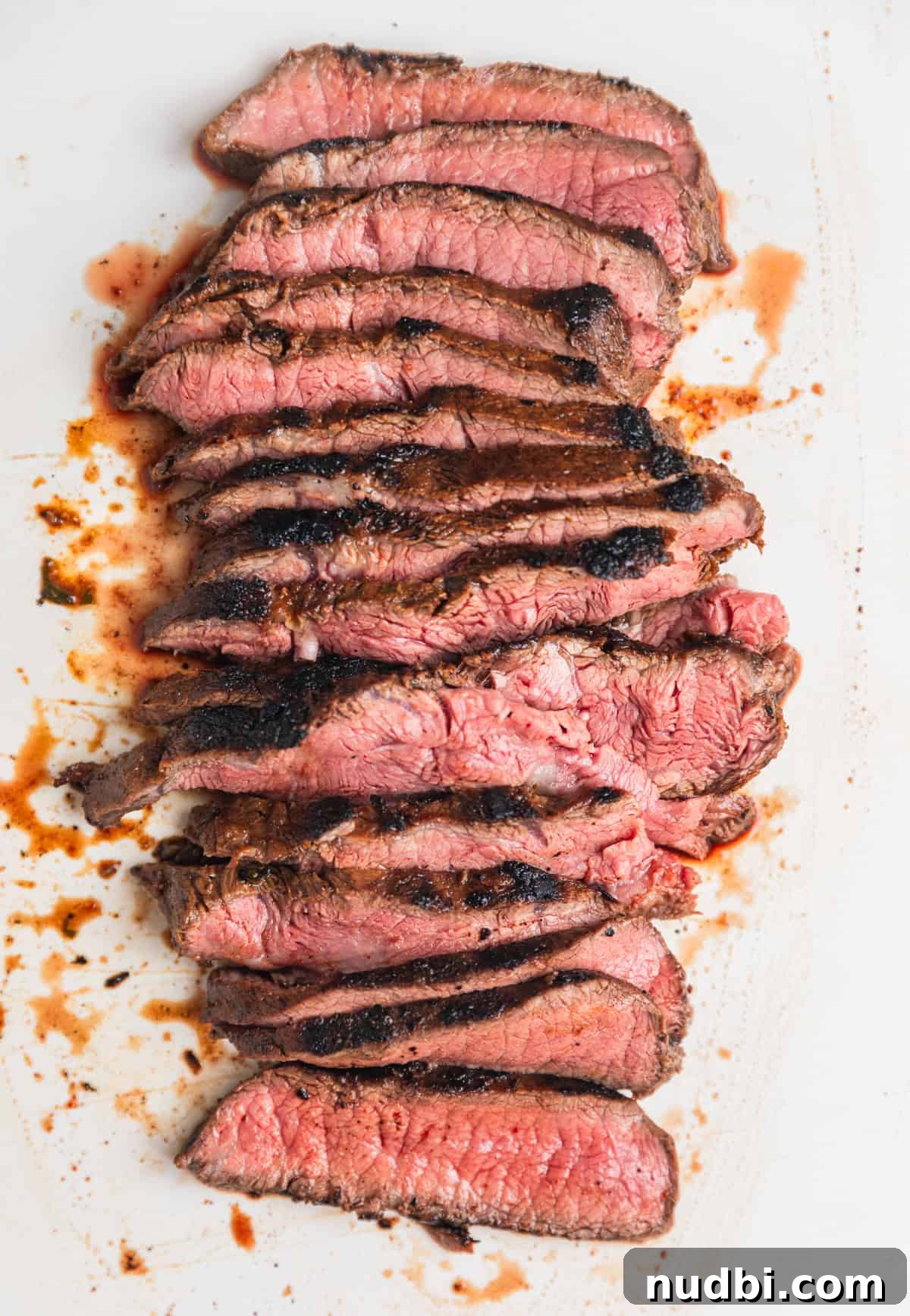 Cilantro-Lime Flat Iron Steak Fajitas Recipe 9 Sliced seared steak on cutting board.