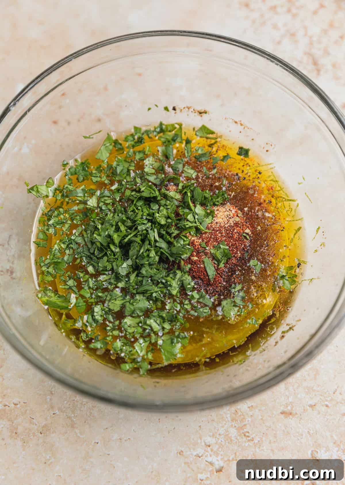 Cilantro-Lime Flat Iron Steak Fajitas Recipe 3 Chopped cilantro, oil, spices and lime juice in bowl.
