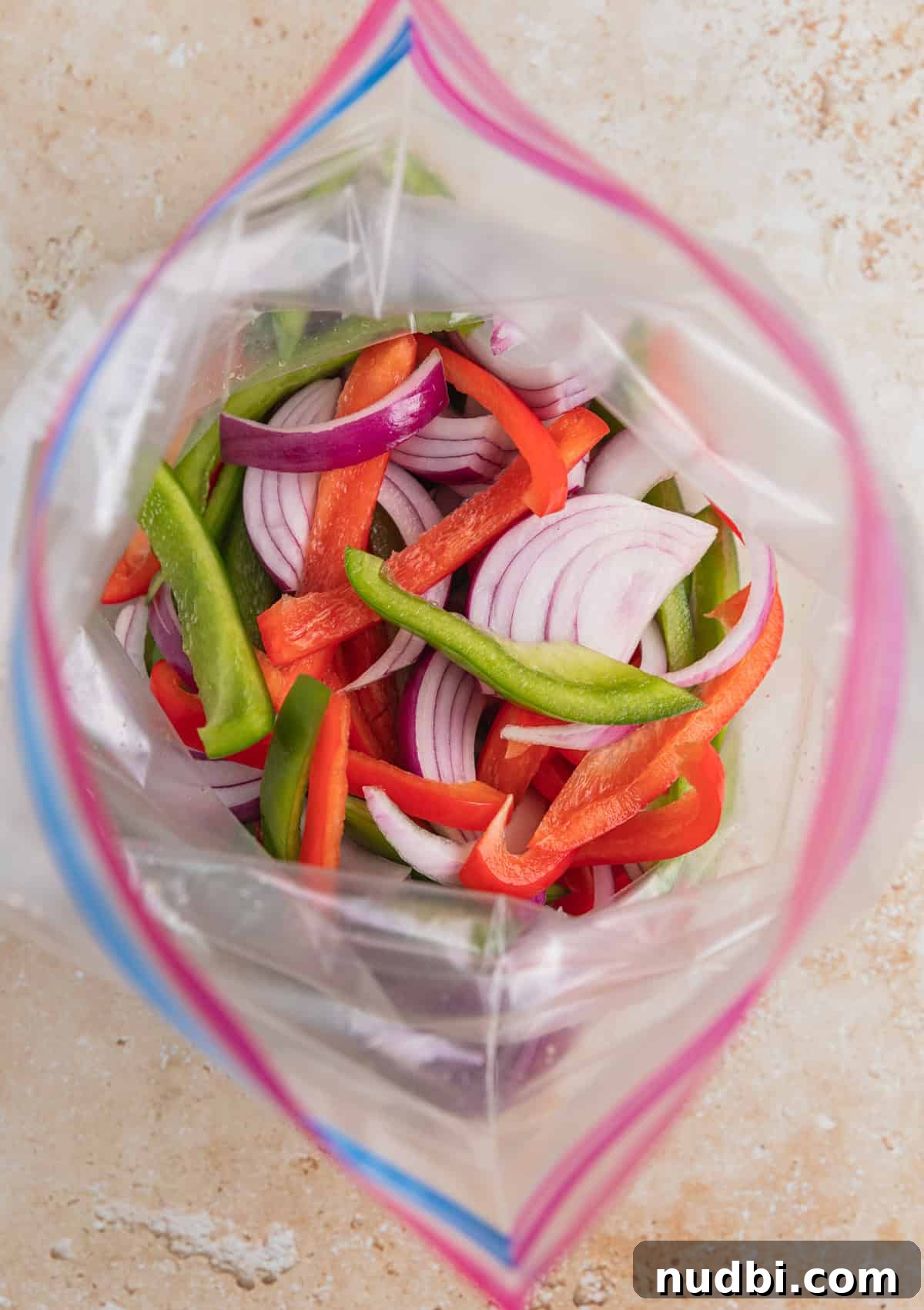 Cilantro-Lime Flat Iron Steak Fajitas Recipe 6 Onions and peppers in plastic bag.