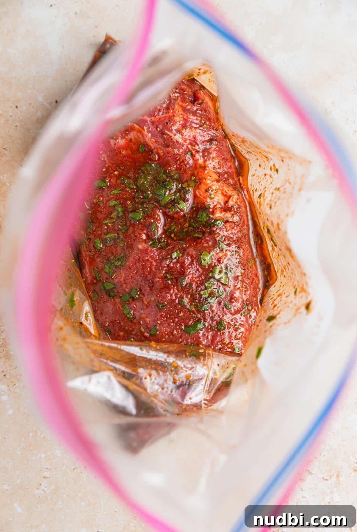 Cilantro-Lime Flat Iron Steak Fajitas Recipe 7 Cilantro lime marinade over top of steak in plastic bag.
