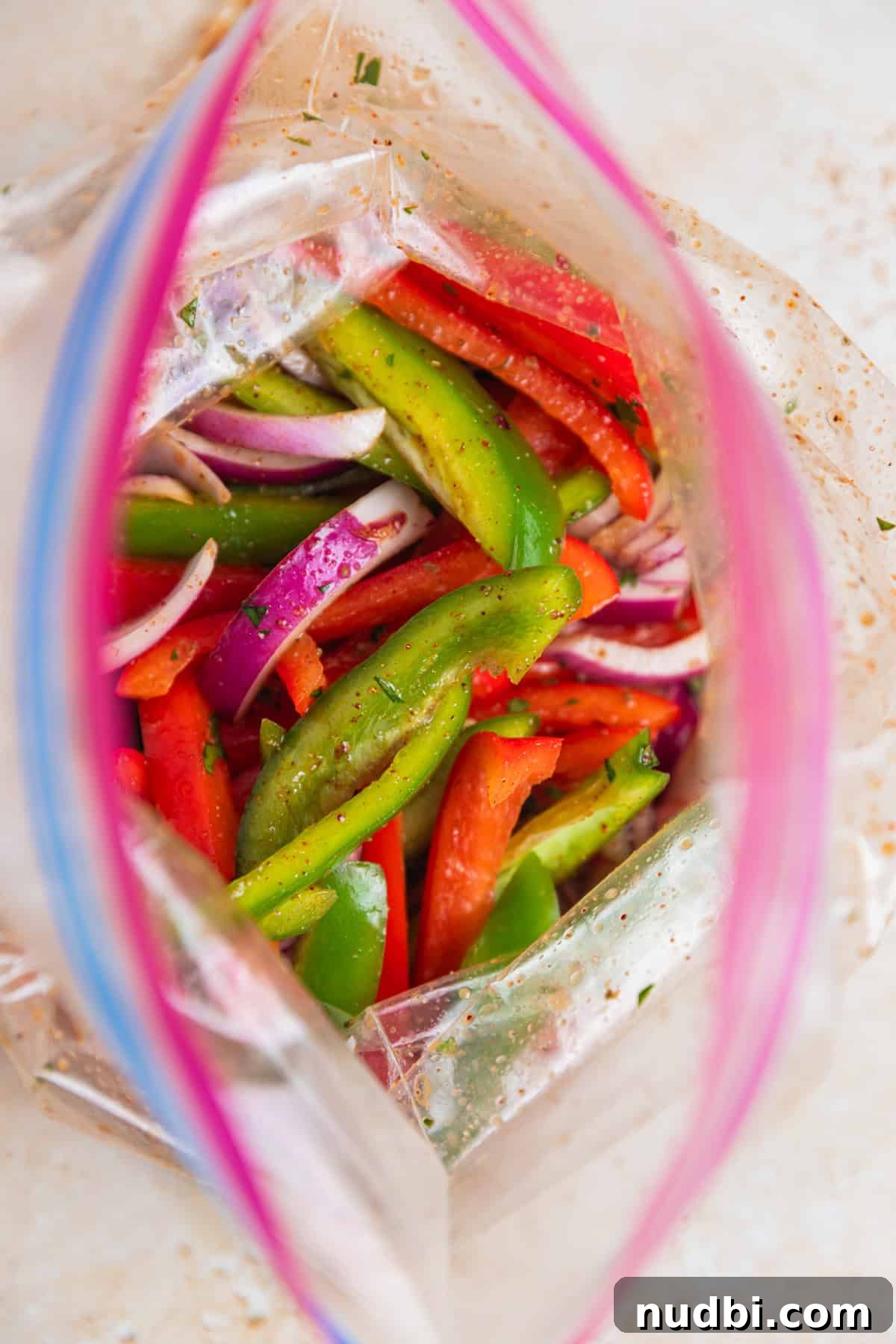 Cilantro-Lime Flat Iron Steak Fajitas Recipe 8 Sliced onions and peppers in ziplock bag tossed in marinade.