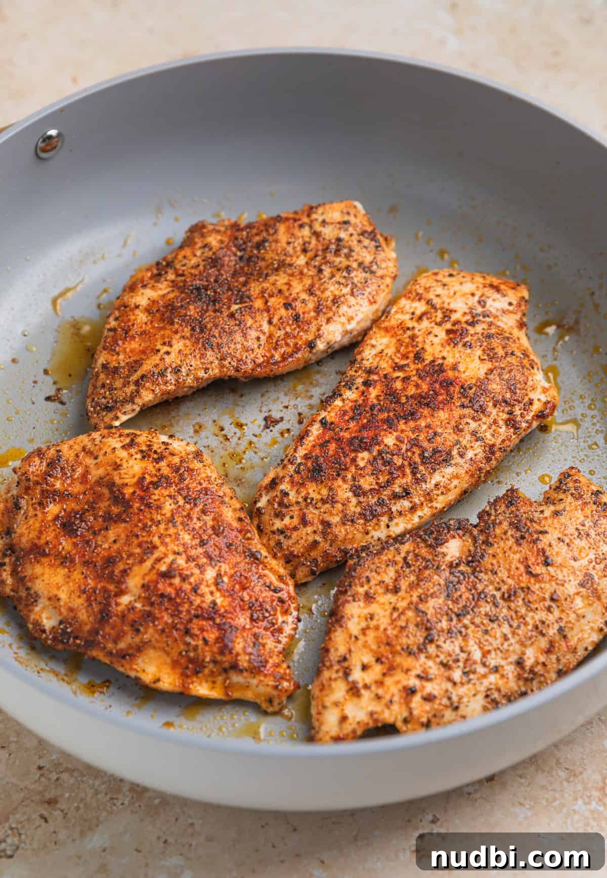 Creamy Chicken Orzo Skillet with Garlic and Parmesan 5 Seared chicken in oiled skilet.