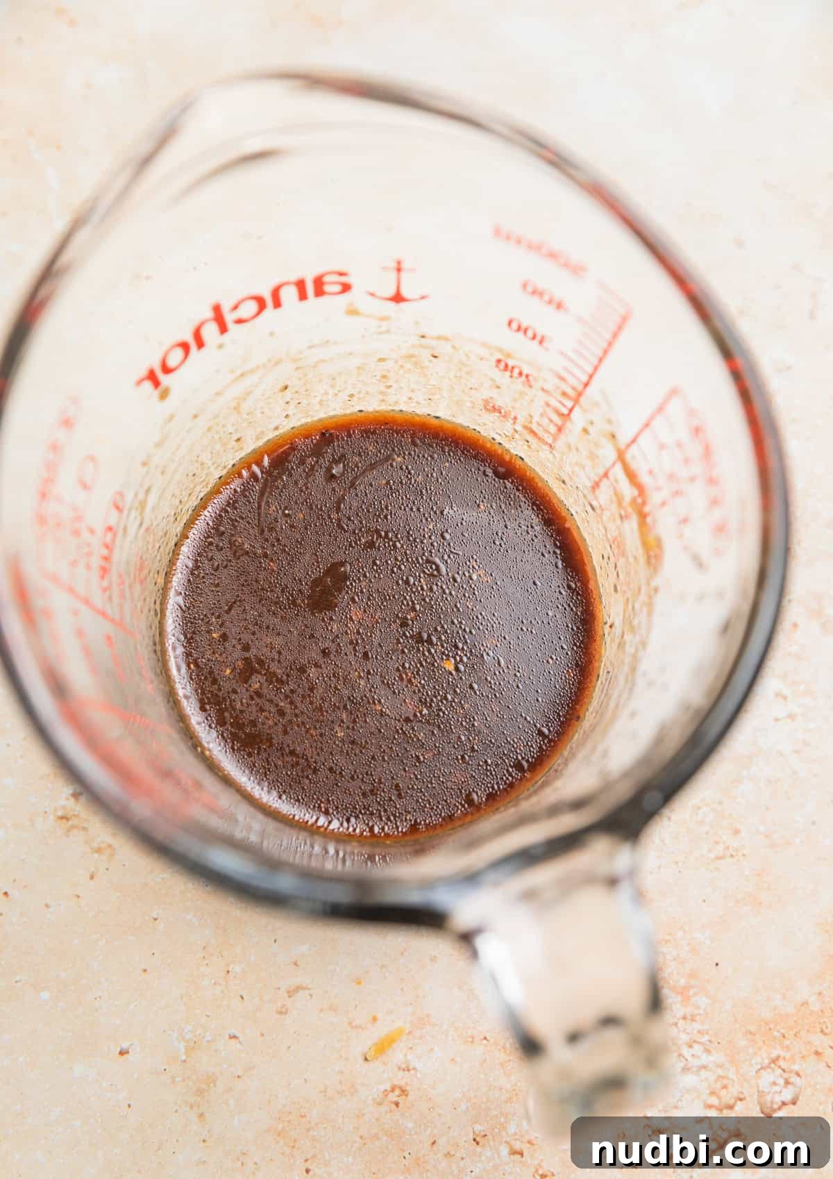 Crisp Apple and Arugula Salad with Honey Dijon Dressing 6 Balsamic dressing mixed in glass measuring cup.