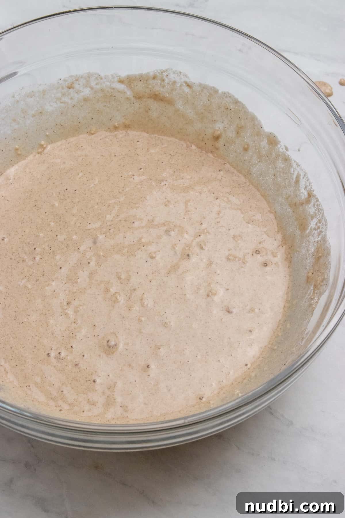 Cinnamon Apple Vegan Waffles — Fluffy Plant-Based Breakfast 3 Waffle batter in mixing bowl.