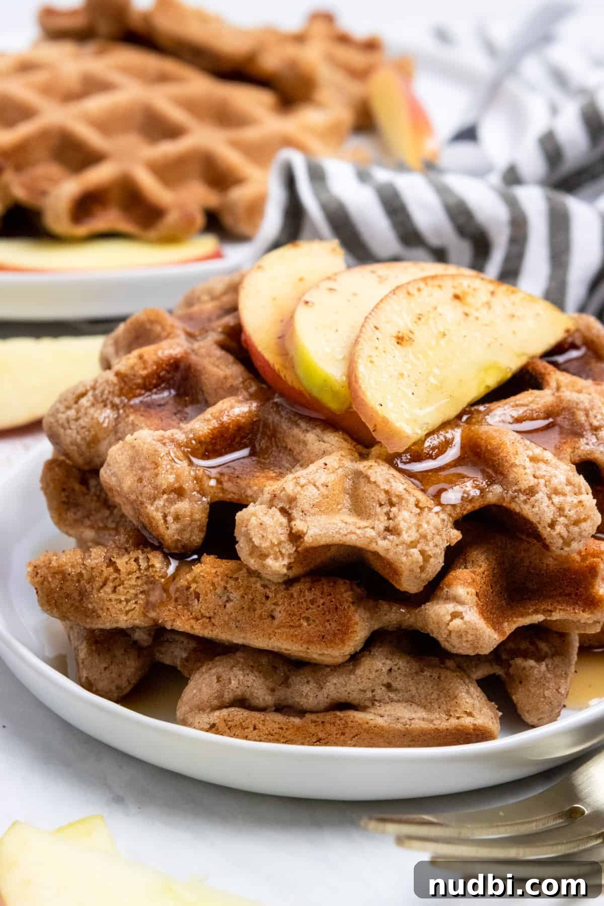 Cinnamon Apple Vegan Waffles — Fluffy Plant-Based Breakfast 4 Stack of waffles with apples on top.