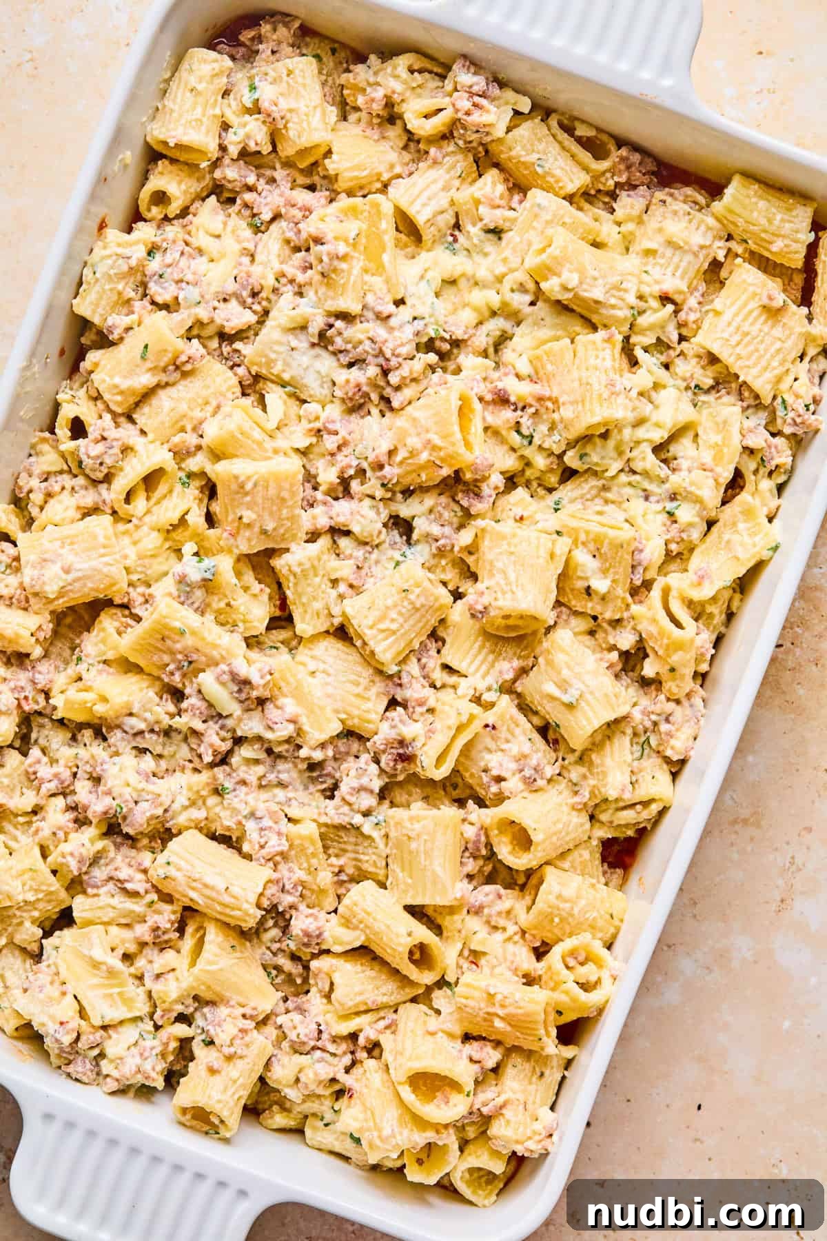 Cheesy Italian Sausage Pasta Bake with Roasted Tomatoes 11 Pasta mixture added over top of marinara sauce.