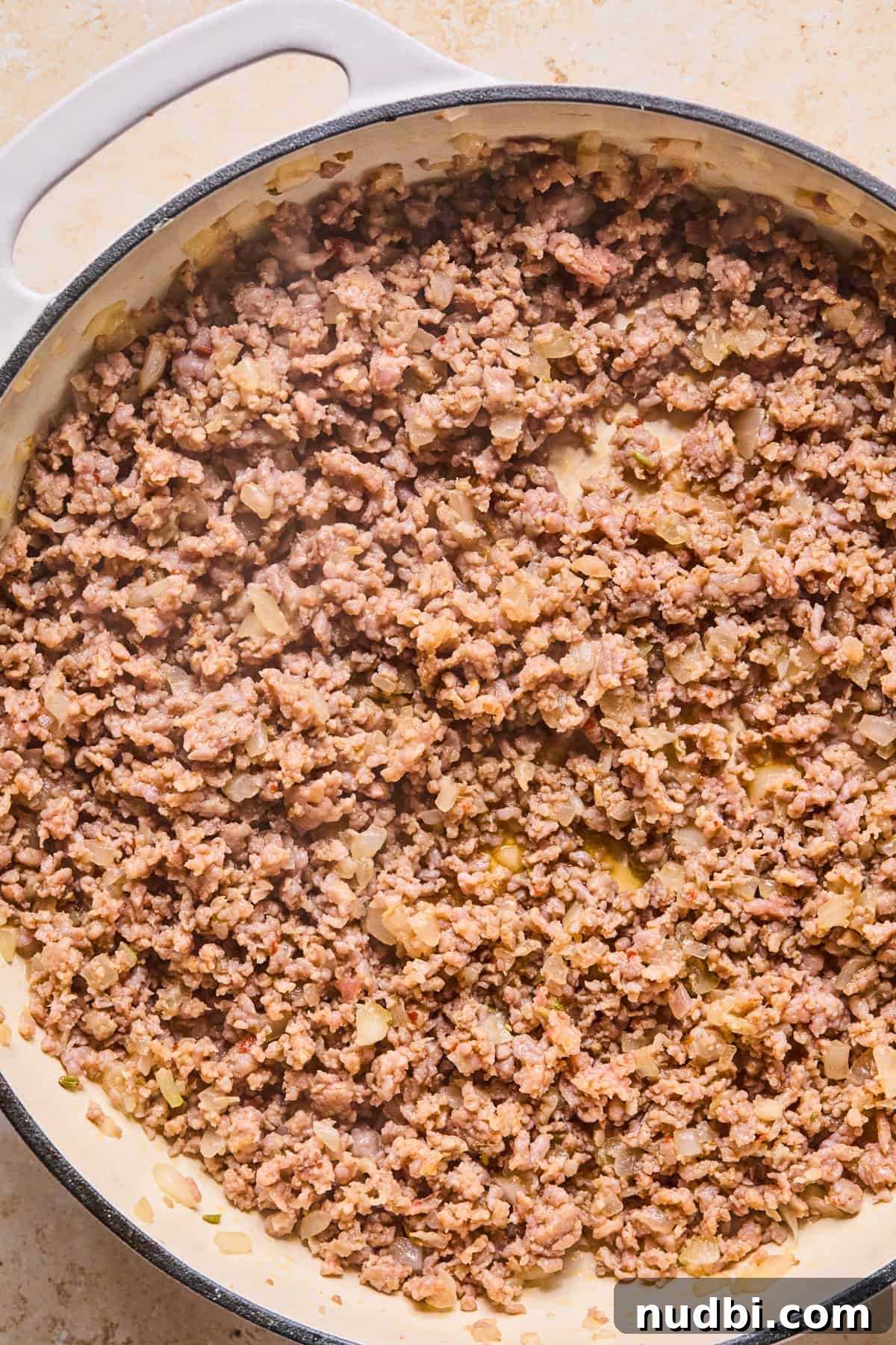Cheesy Italian Sausage Pasta Bake with Roasted Tomatoes 6 Italian sausage and onions browned in skillet.