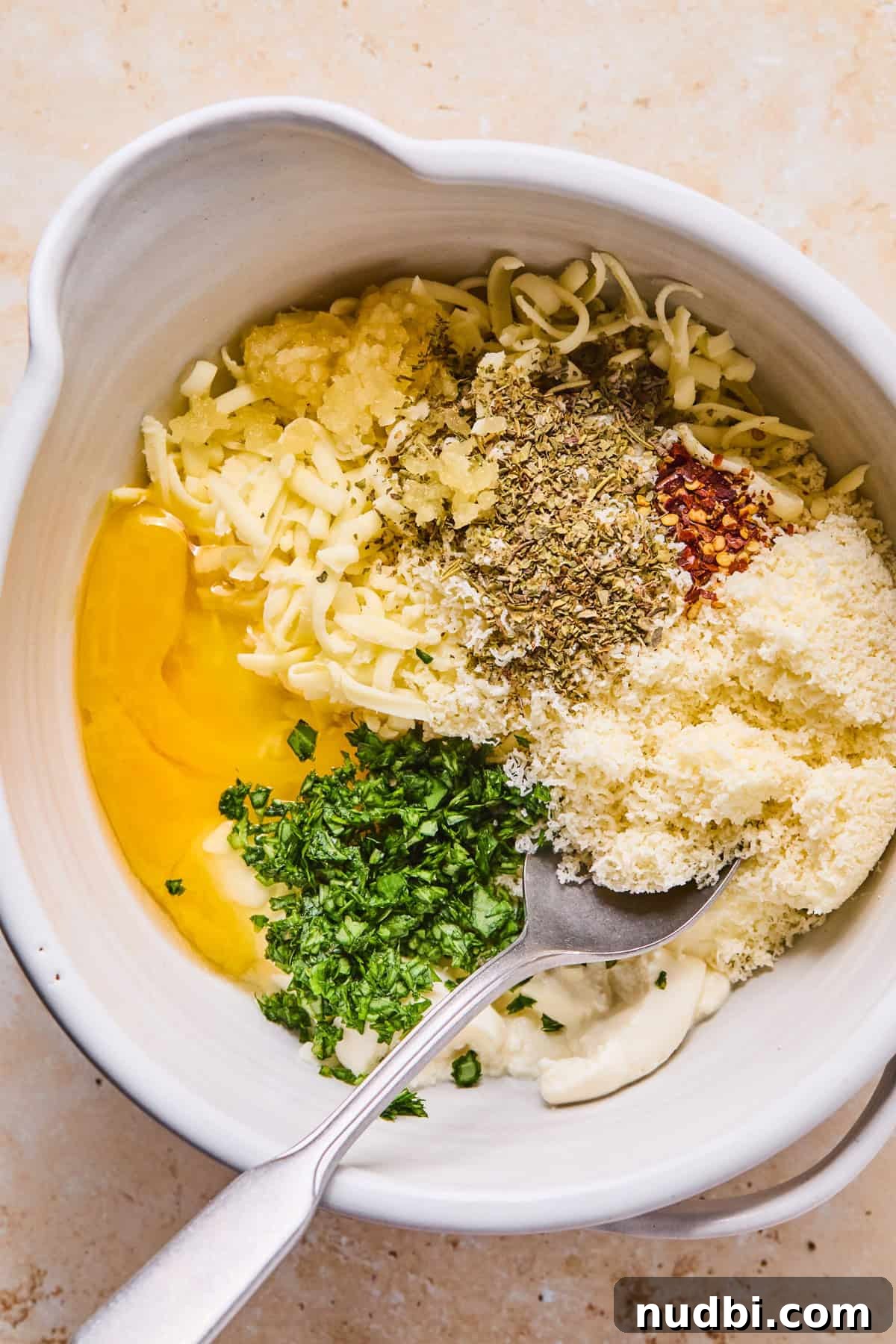 Cheesy Italian Sausage Pasta Bake with Roasted Tomatoes 7 Mixing bowl with egg, ricotta and other ingredients.