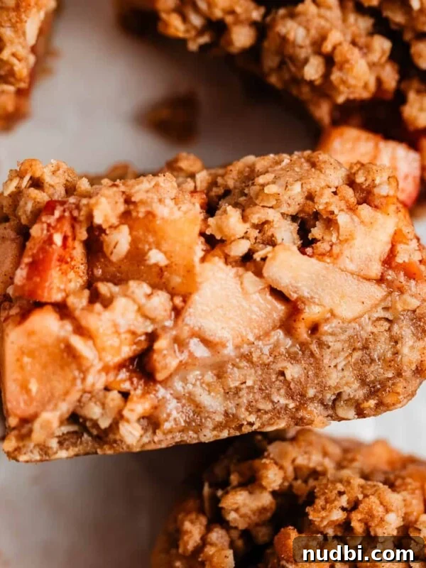 Crisp Puff Pastry Apple Tart Recipe for Homemade Dessert 8 Apple crumble bar propped on surrounding sliced bars.