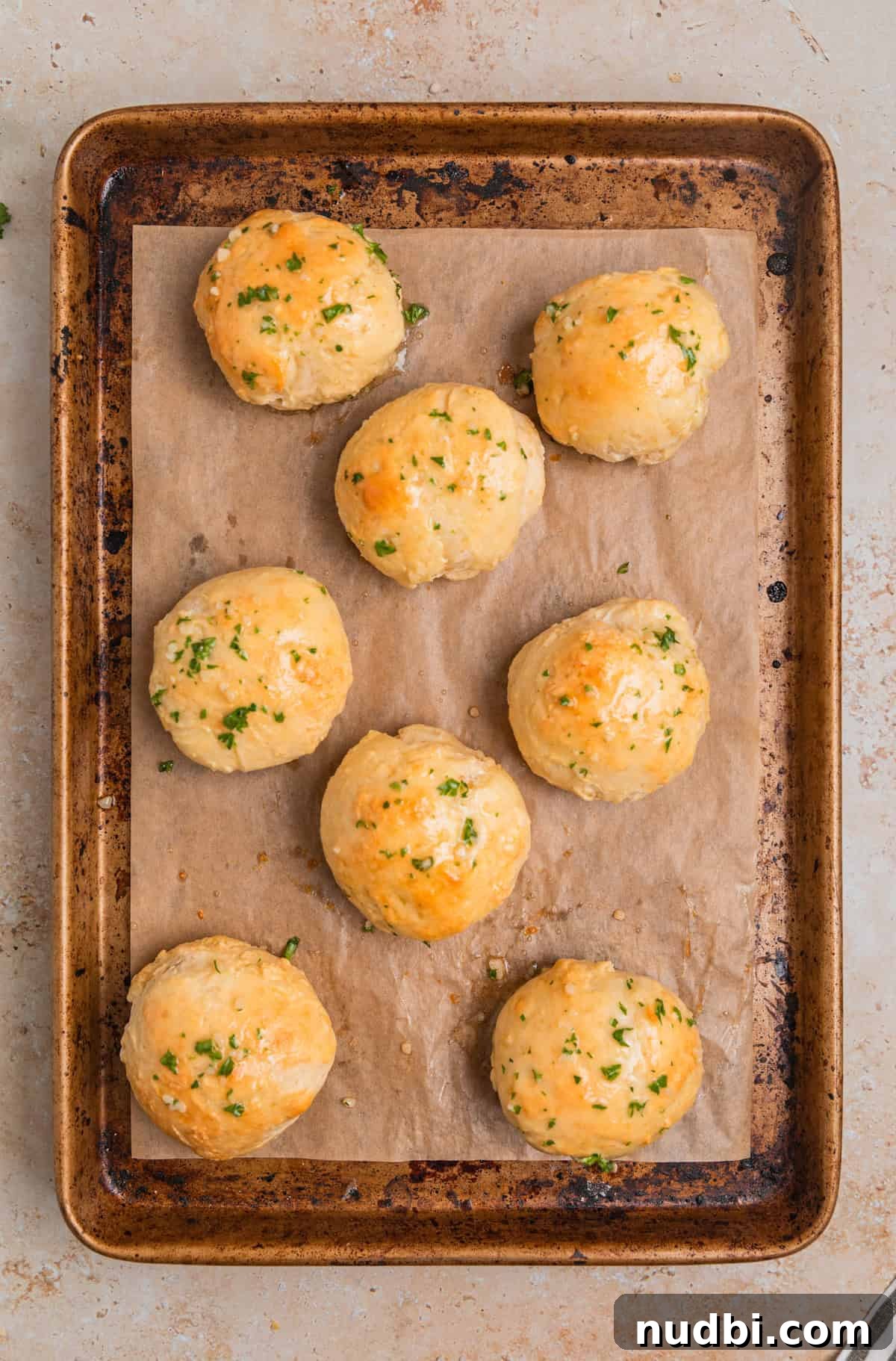 Quick No-Yeast Dinner Rolls Recipe for Soft, Fast Bread 11 Garlic herb butter brushed on rolls on sheet pan.