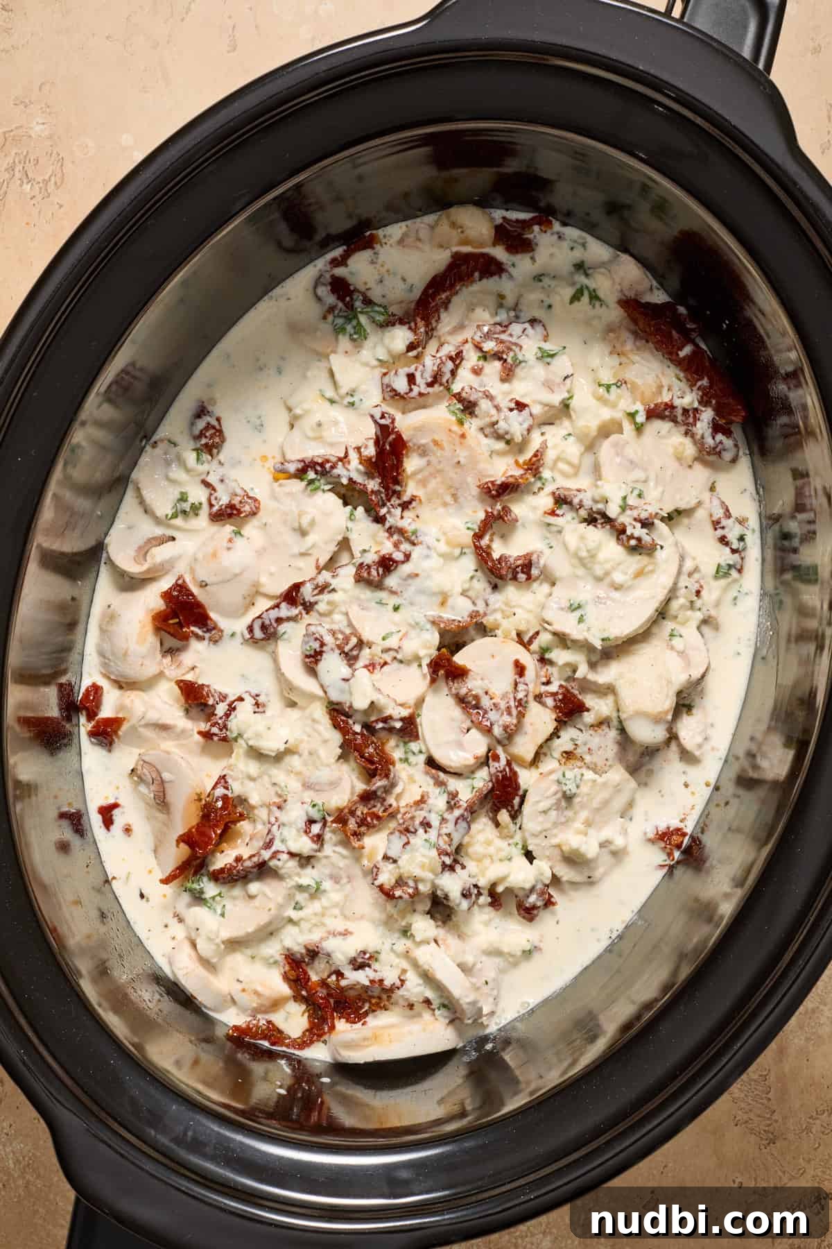 Creamy Slow Cooker Chicken Pasta Recipe 8 Seasoned chicken breast topped with mushrooms and sun-dried tomatoes and cream mixture.