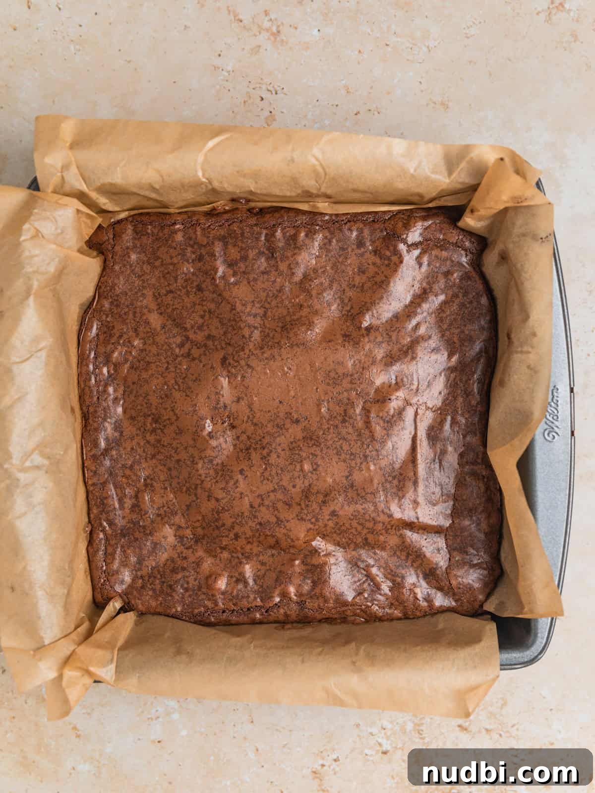 Peppermint Bark Brownies Recipe: Fudgy Chocolate Mint Bars 10 Freshly baked brownies in pan.