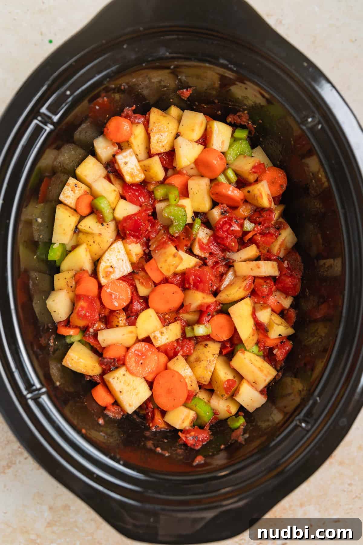 Slow Cooker Hamburger Soup Recipe for Hearty Weeknight Meals 3 Mixed soup ingredients in slow cooker.