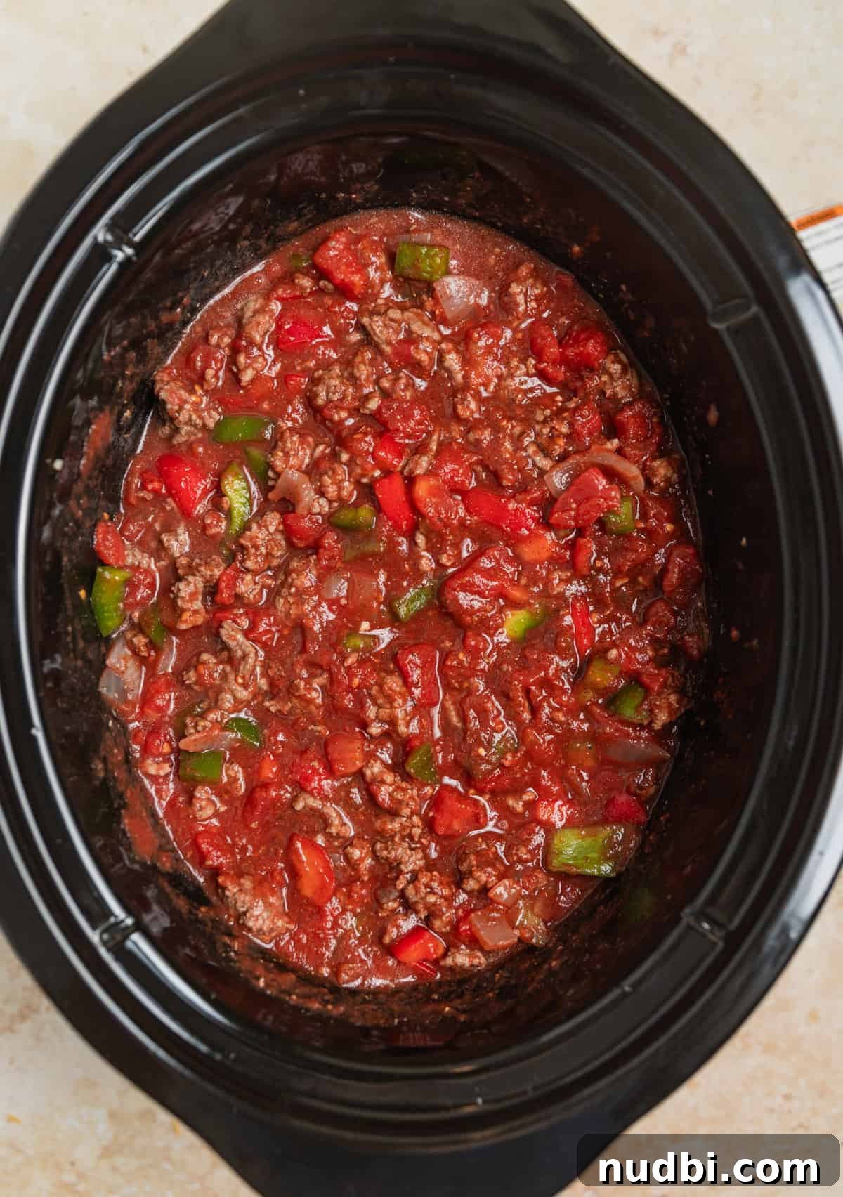 Hearty No-Bean Slow Cooker Chili Recipe 6 Stirred crock pot chili ingredients in pot before cooking.