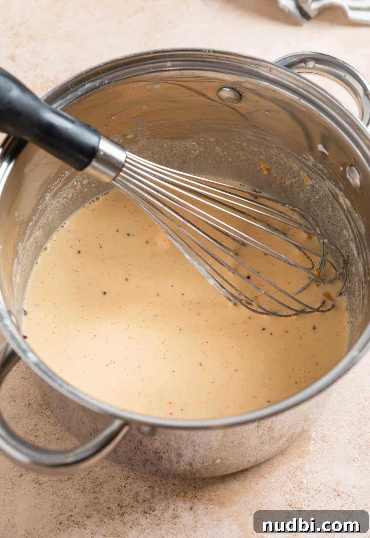 High-Protein Mac and Cheese Recipe for Muscle Gain 6 Whisk in large pot with mac and cheese sauce.