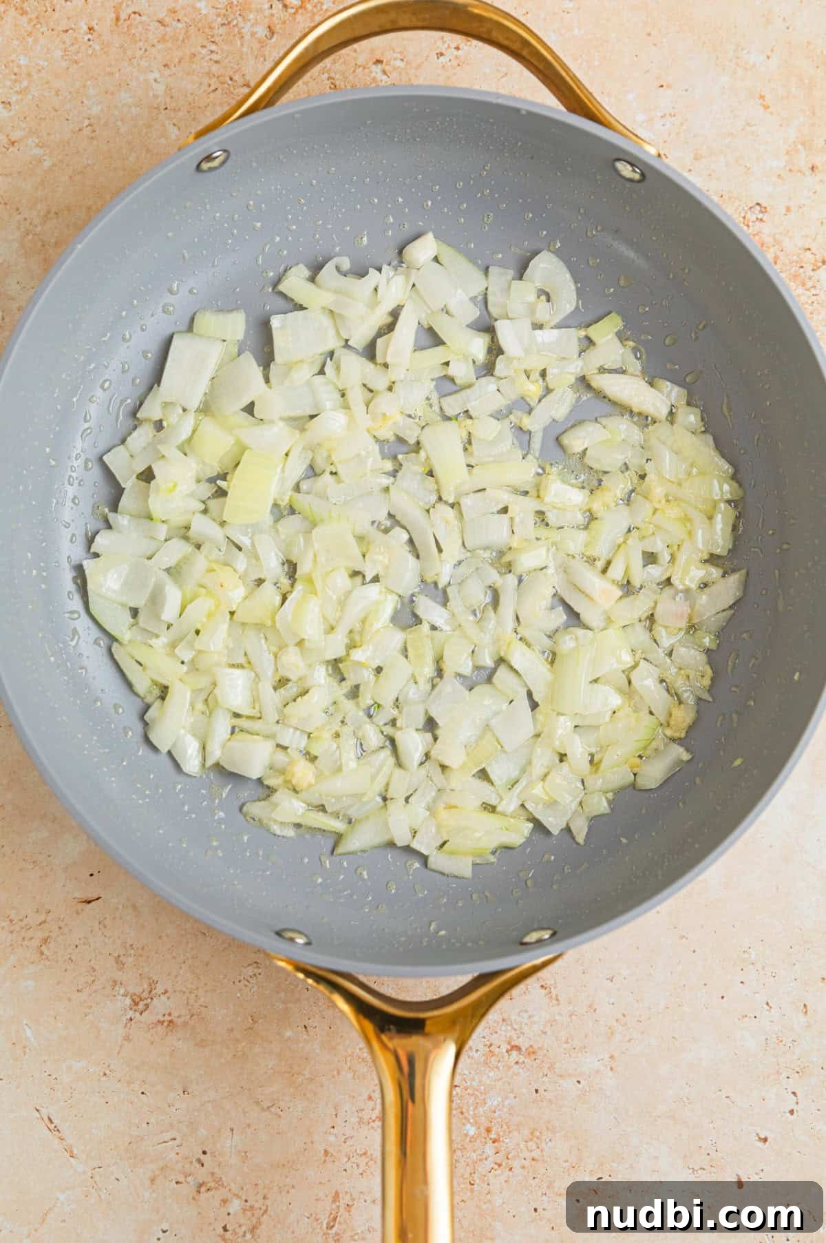 Creamy Ground Turkey Stroganoff Recipe for Weeknight Dinner 4 Sautéed onions in butter in skillet.