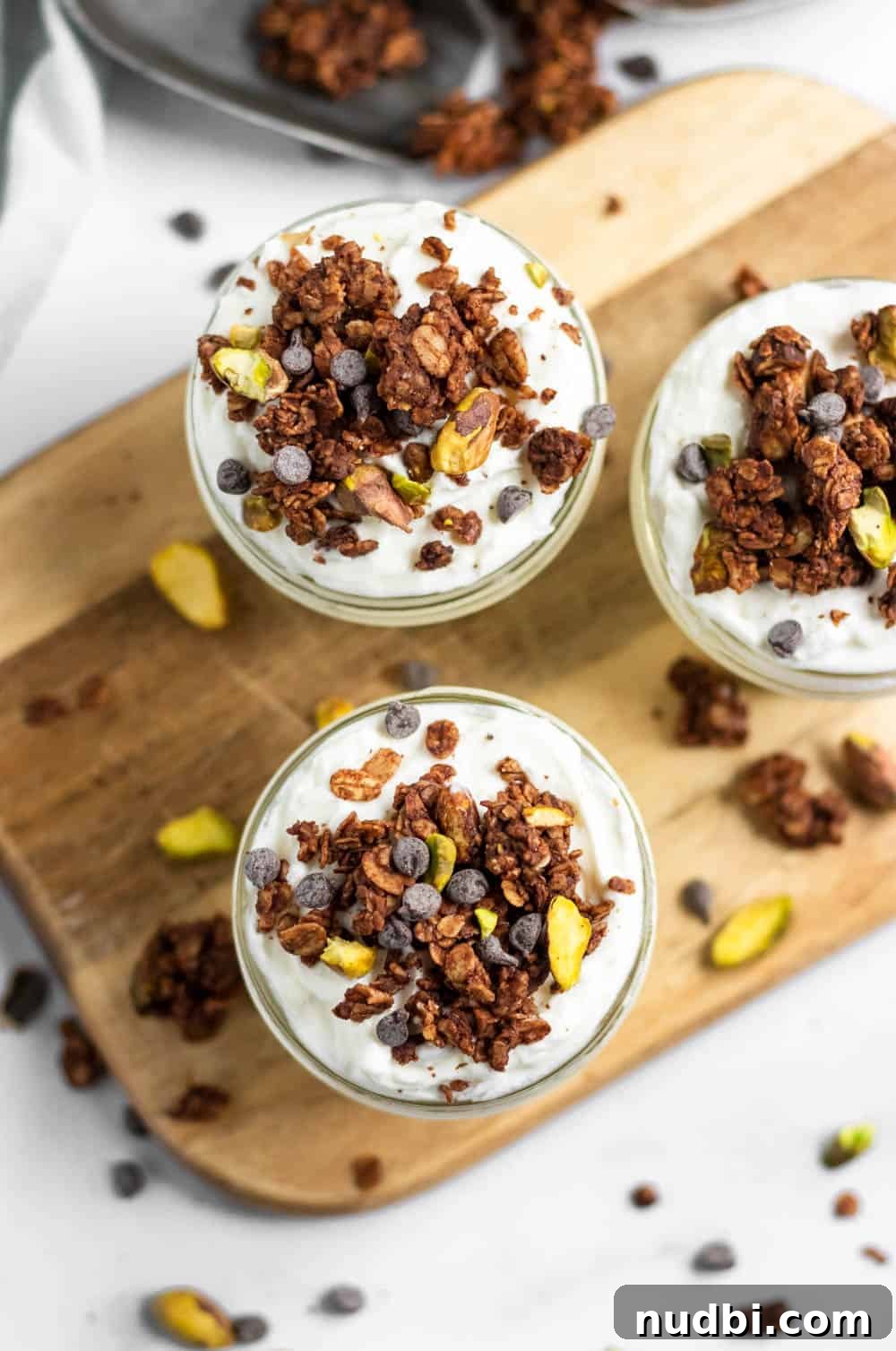Chocolate Pistachio Granola with Sea Salt — Crunchy Homemade Recipe 4 Overhead view of chocolate granola on yogurt.