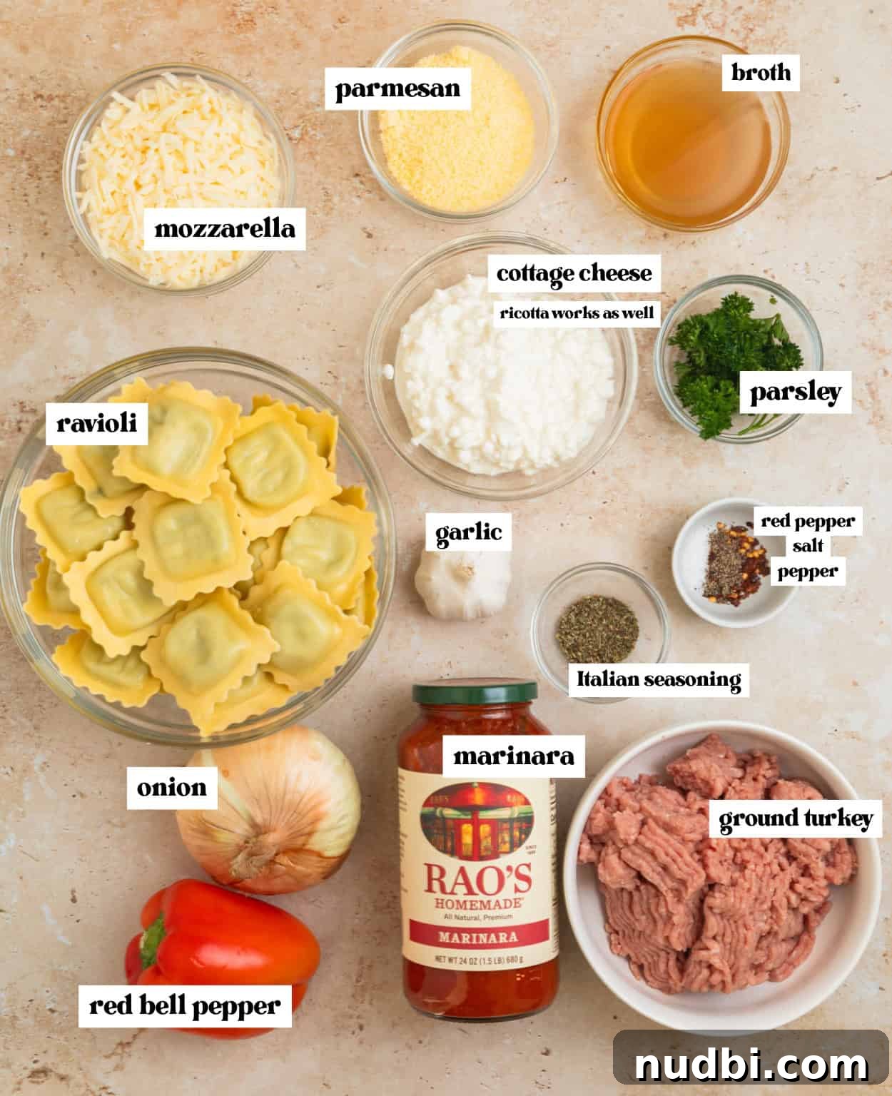Skillet Ravioli Lasagna Recipe: Quick One-Pan Italian Dinner 3 Cheese, ravioli, ground turkey, seasoning and other ingredients arranged on surface.