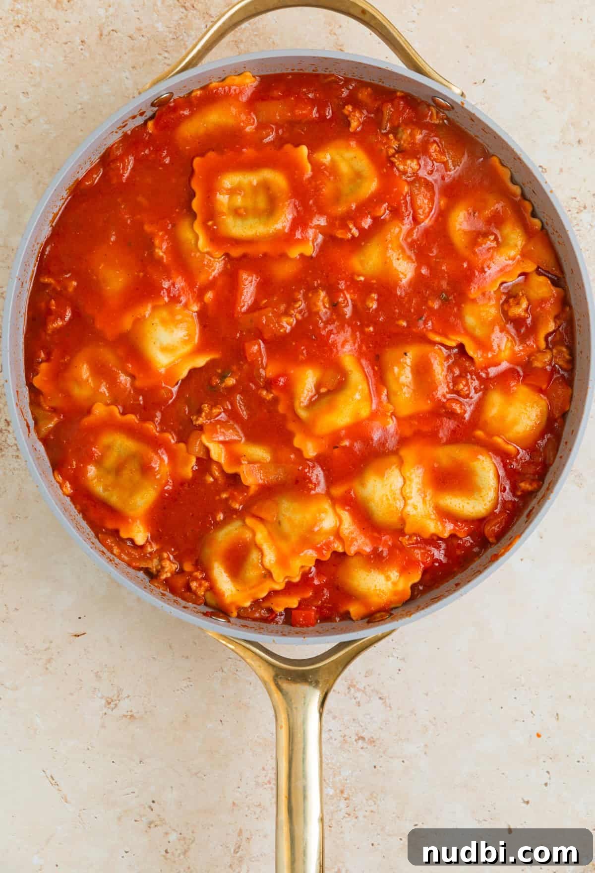 Skillet Ravioli Lasagna Recipe: Quick One-Pan Italian Dinner 9 Lasagna cooked al dente in skillet with marinara.