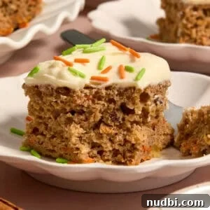 Moist Carrot Cake Recipe Using Cake Mix 17 Slice of carrot cake made from a box mix on plate.