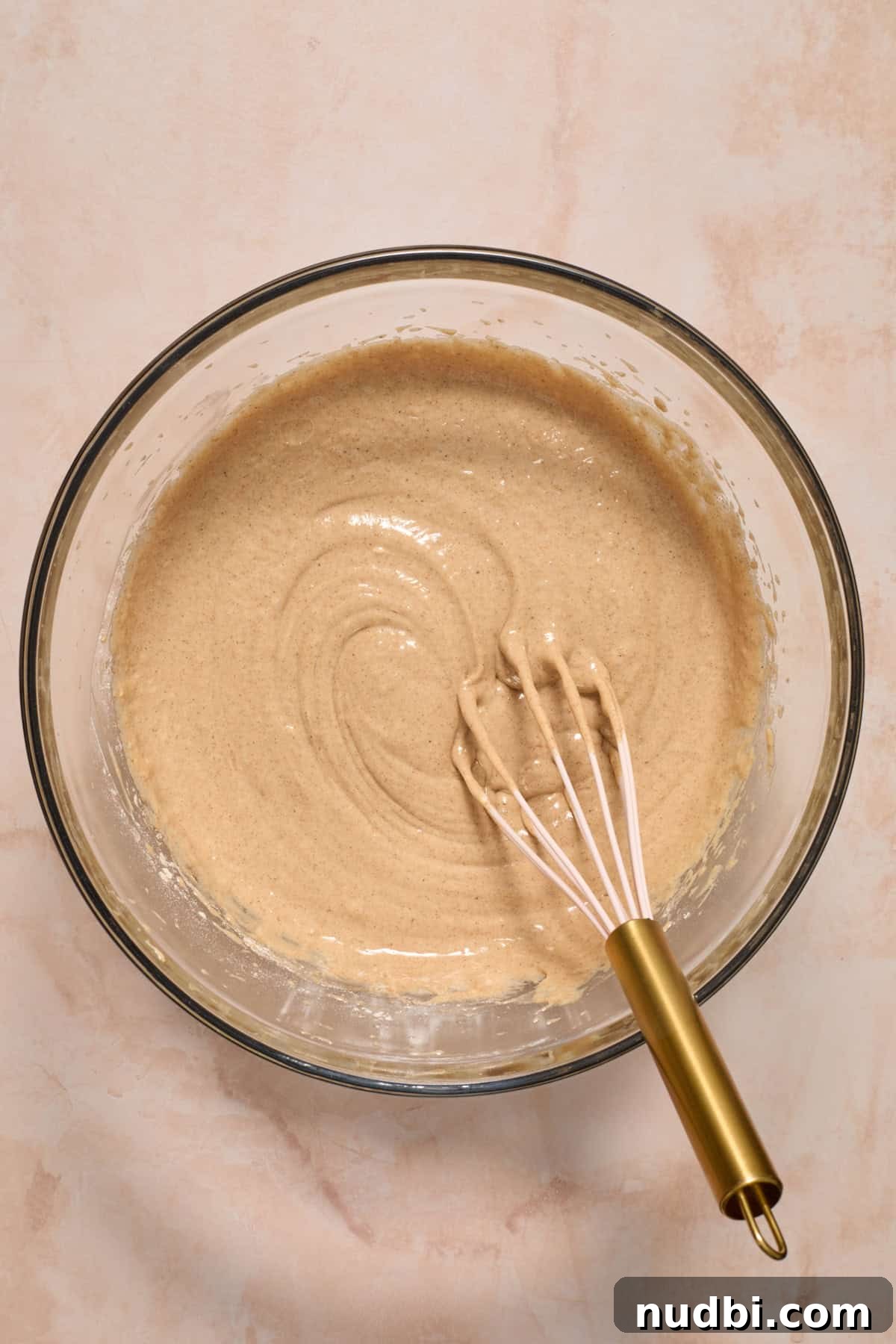 Moist Carrot Cake Recipe Using Cake Mix 5 Carrot cake batter mixture in bowl with spoon before adding carrots.