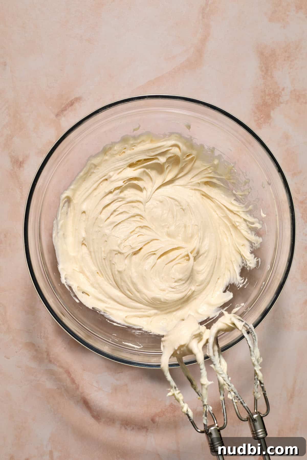 Moist Carrot Cake Recipe Using Cake Mix 10 Cream cheese frosting whipped with cream cheese in glass bowl.