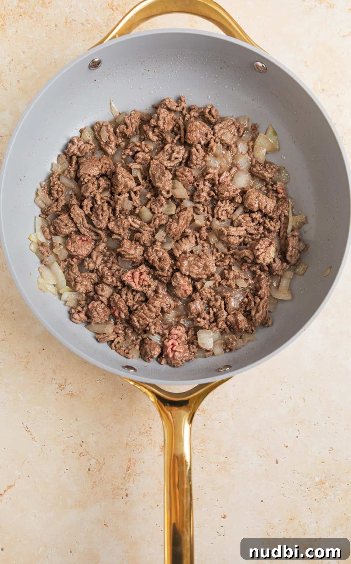 Creamy One-Pot Ground Beef Stroganoff Recipe 4 Ground beef and onions in skillet.