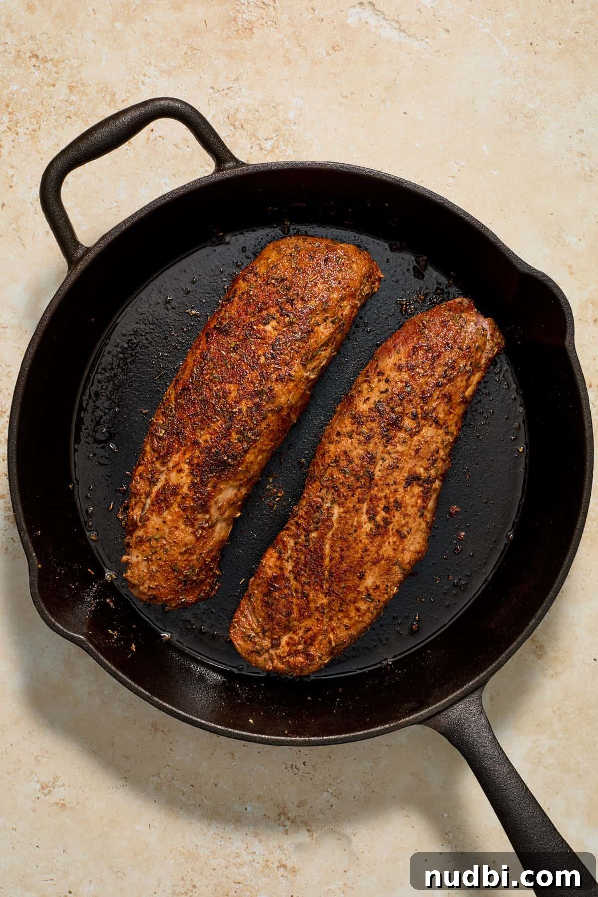 Juicy Pork Tenderloin with Creamy Mustard Sauce receta 6 Seared pork tenderloin in skillet.