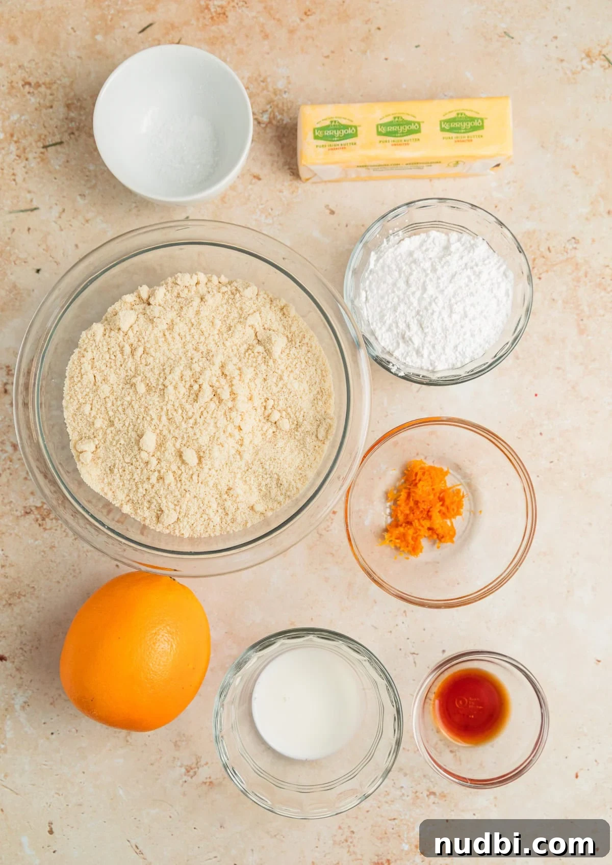 Almond Flour Orange Cookies Recipe — Light Citrus Cookie Guide 3 Orange, orange zest, almond flour and other ingredients on surface.