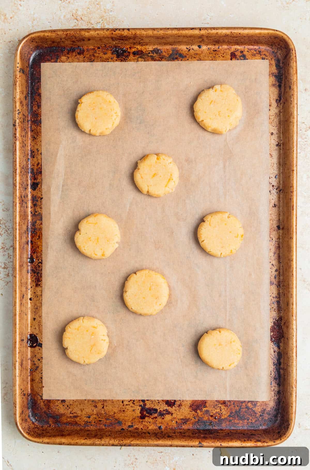 Almond Flour Orange Cookies Recipe — Light Citrus Cookie Guide 7 Pressed cookie dough on cookie sheet.