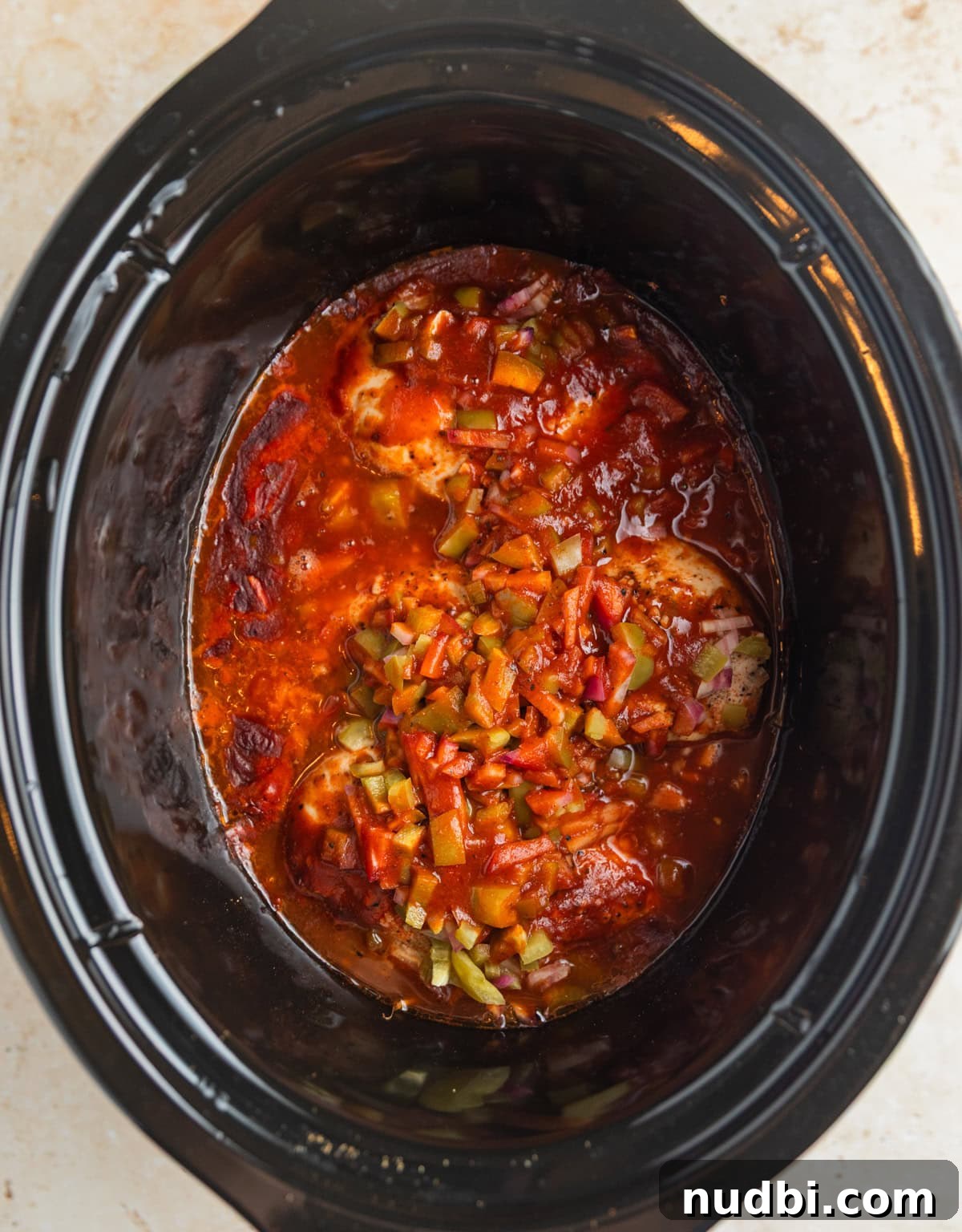 Slow Cooker BBQ Chicken Tacos with Crunchy Lime Slaw 5 Cooked bbq chicken in slow cooker before shredding.