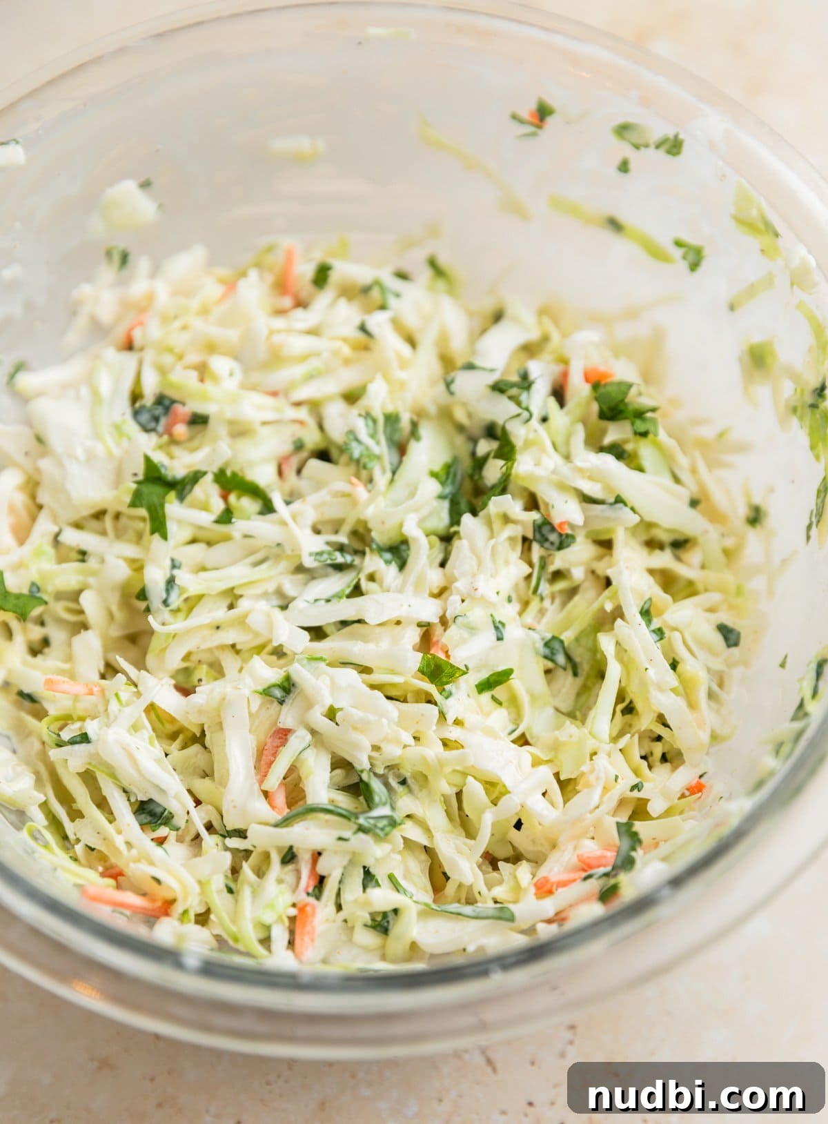 Slow Cooker BBQ Chicken Tacos with Crunchy Lime Slaw 8 Cilantro lime slaw mixed in bowl.