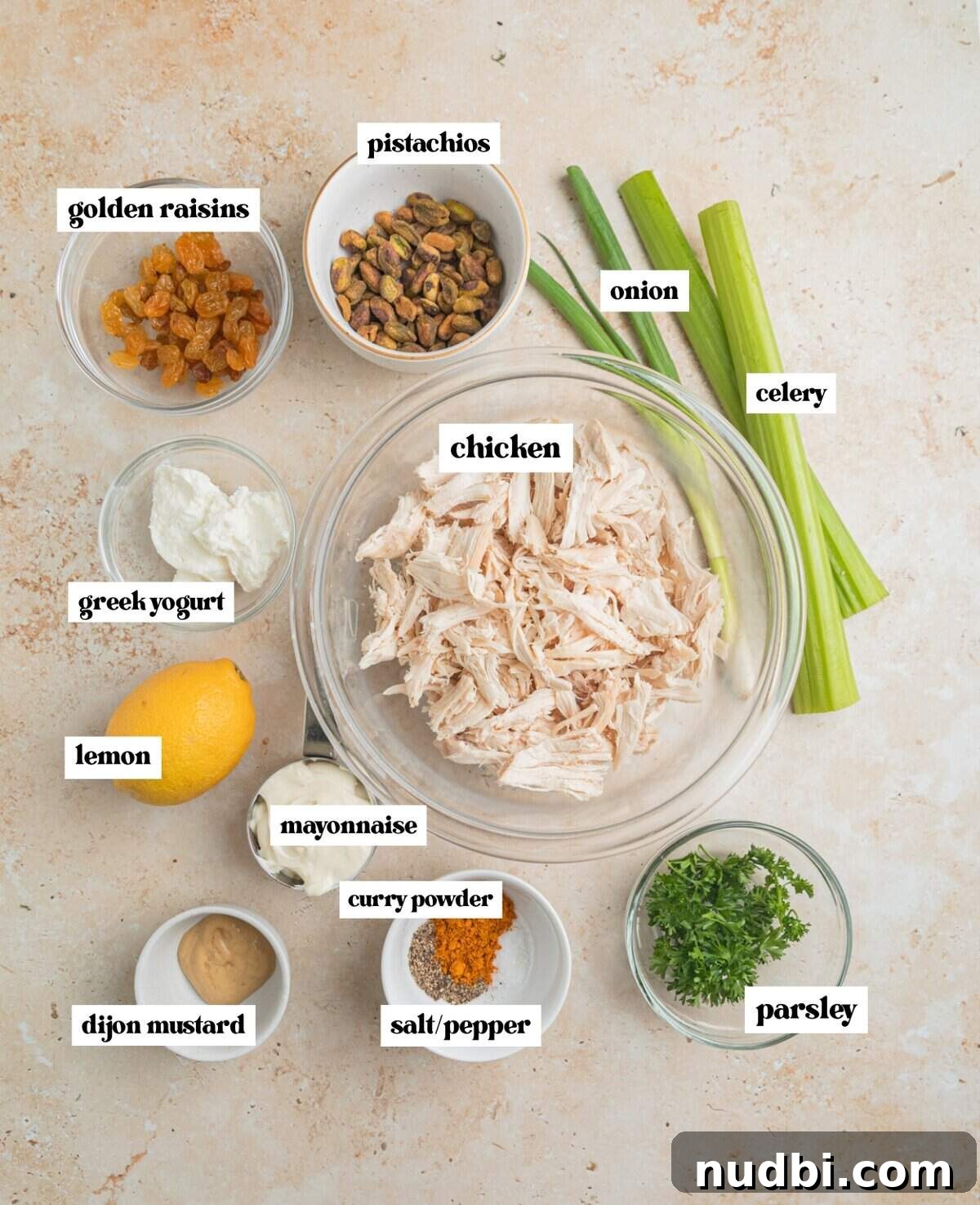 Creamy Curry Chicken Salad Recipe for Lunch or Light Dinner 3 Shredded chicken, celery, onion, parsley, mayo and other ingredients labeled.