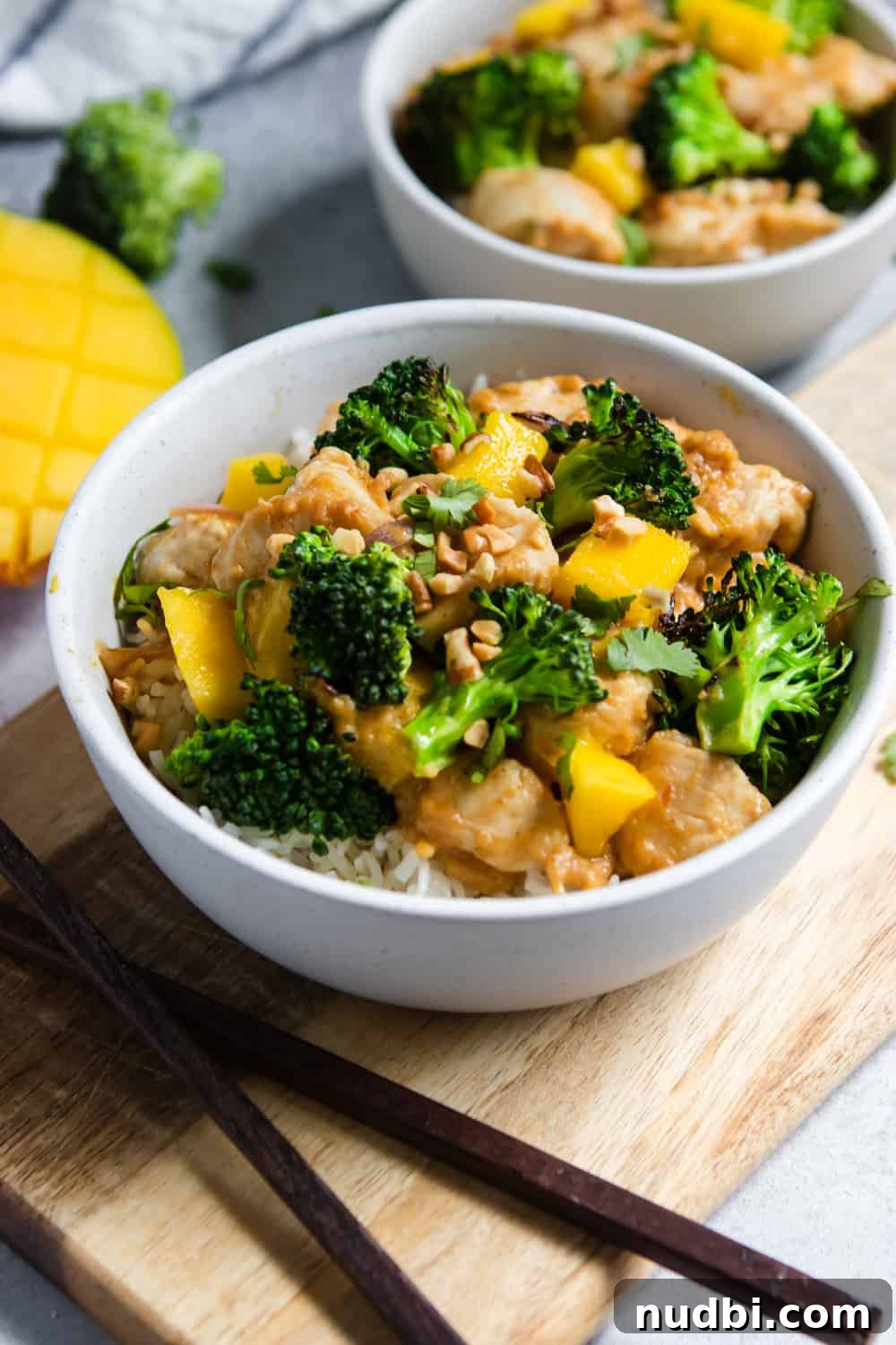 Peanut Mango Chicken Stir-Fry with Jasmine Rice Recipe 3 Bowl of stir fry with broccoli, mango and chicken.