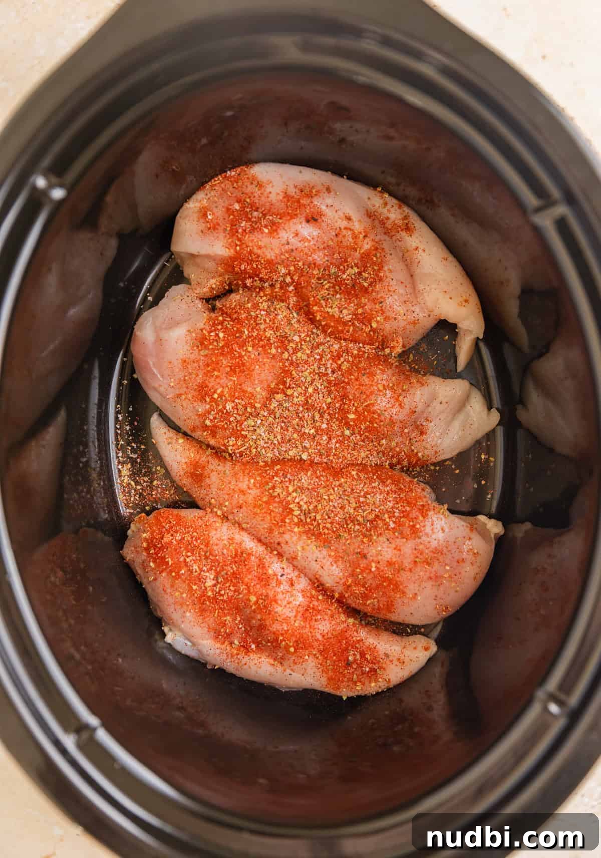 Slow Cooker Honey Mustard Chicken Recipe for Tender, Saucy Results 4 Seasoned chicken breasts in crock pot.
