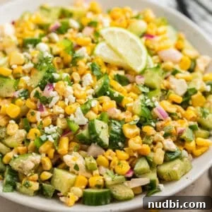 Cucumber and Sweet Corn Salad with Herb Vinaigrette 13 Cucumber corn salad in serving dish topped with chopped jalapeño and cilantro.