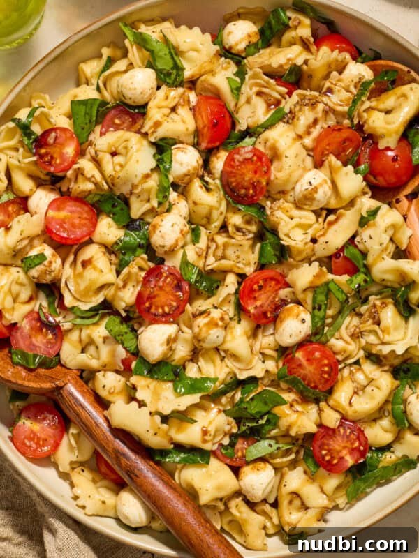 Cucumber and Sweet Corn Salad with Herb Vinaigrette 9 Tortellini caprese salad in bowl topped with balsamic glaze.