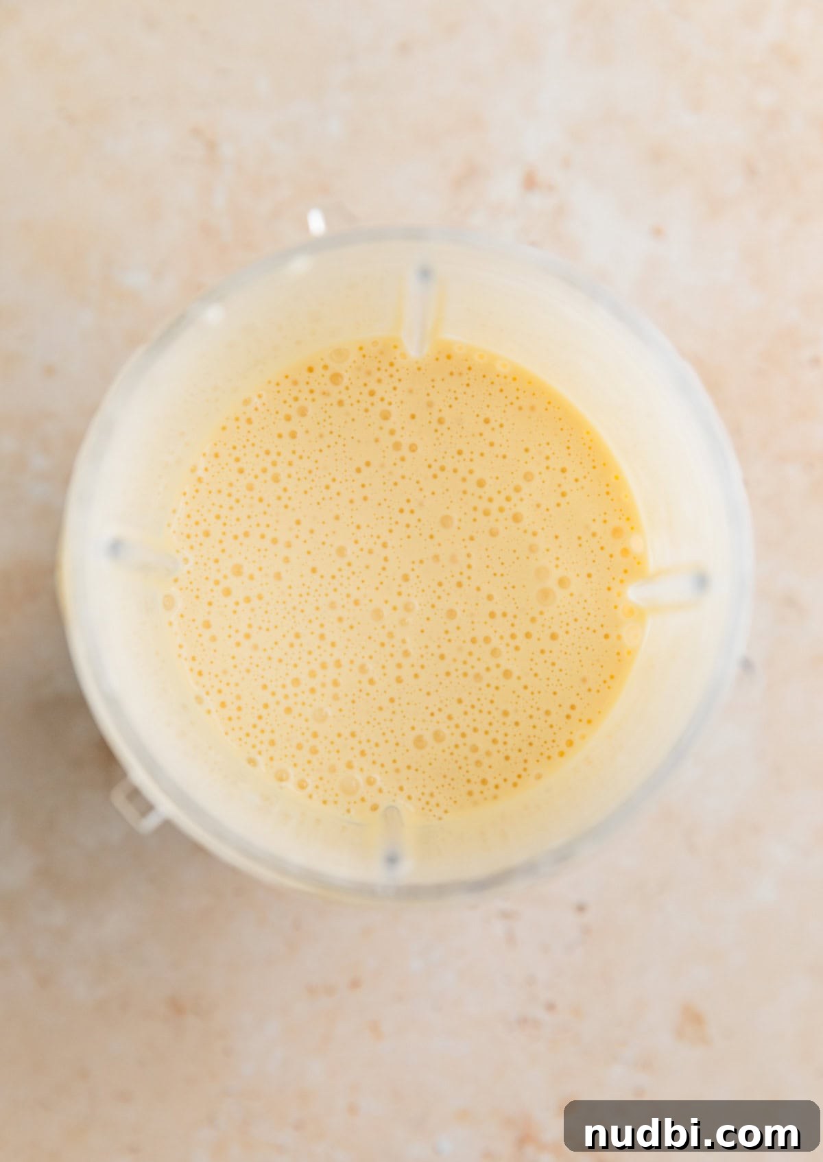Blended eggs and cottage cheese in blender cup.