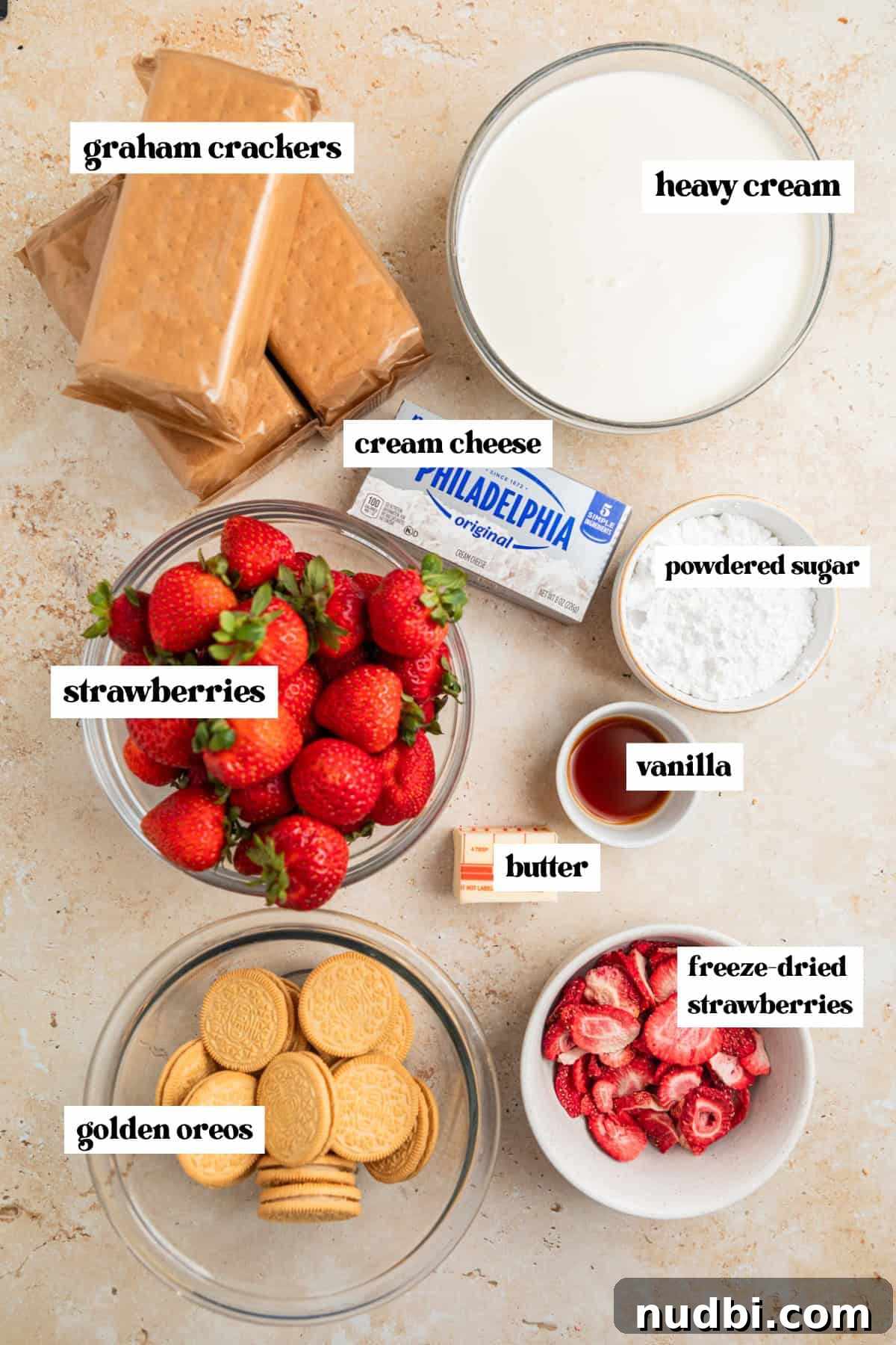 Strawberry Cream Cheese Icebox Cake Recipe for Summer Desserts 3 Graham crackers, whipping cream, vanilla, cream cheese and other ingredients labeled on surface.