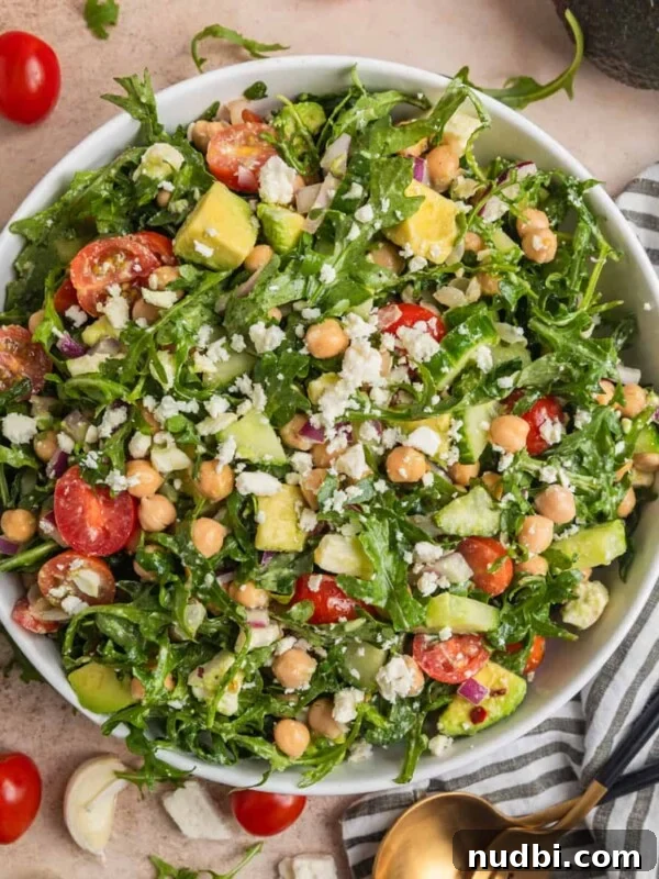 Zesty Chili Lime Chicken Recipe for Tender Grilled Chicken 12 Chickpea avocado salad in bowl with arugula, feta, cucumbers, tomato and other ingredients.