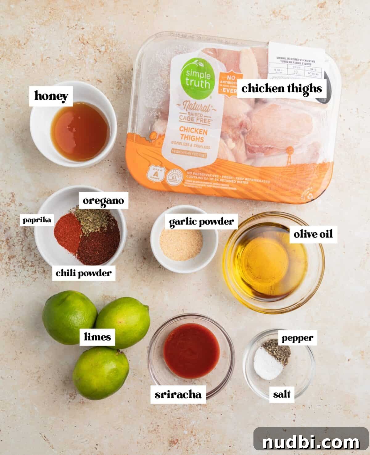 Zesty Chili Lime Chicken Recipe for Tender Grilled Chicken 3 Honey, limes, chicken thighs, and other ingredients labeled on surface.