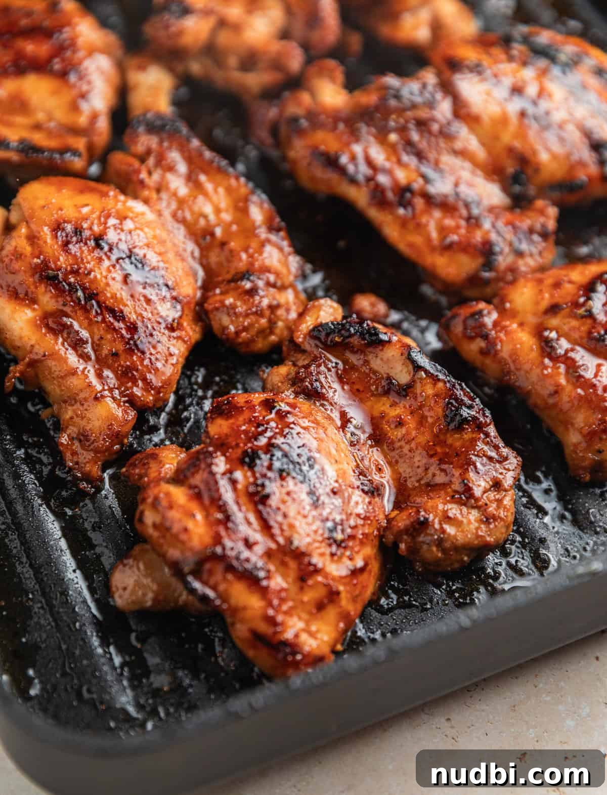 Zesty Chili Lime Chicken Recipe for Tender Grilled Chicken 7 Chicken grilled on grill pan with extra marinade spread over top.
