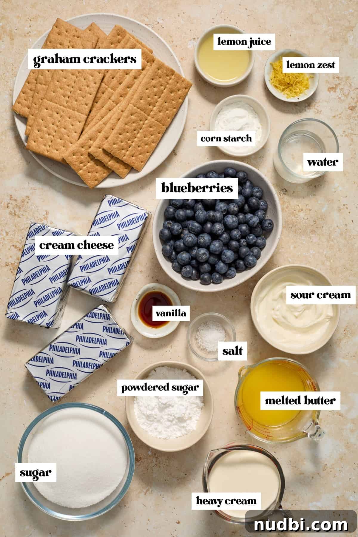 No-Bake Lemon Blueberry Cheesecake Recipe — Light & Creamy Dessert 3 Labeled ingredients needed to make no bake blueberry lemon cheesecake.