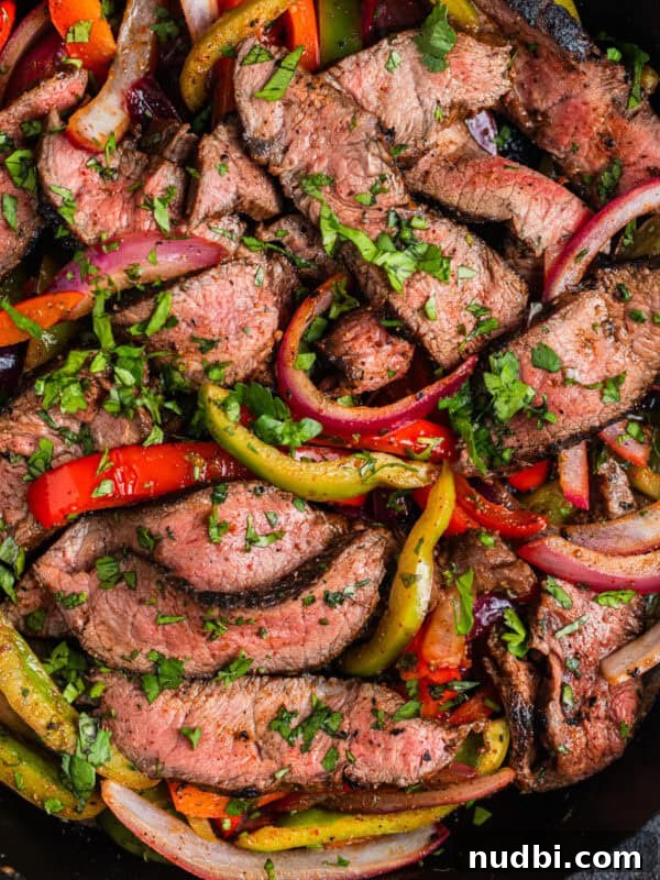 Grilled Ribeye with Creamy Gorgonzola Sauce Recipe 14 Skillet with steak fajitas topped with cilantro.