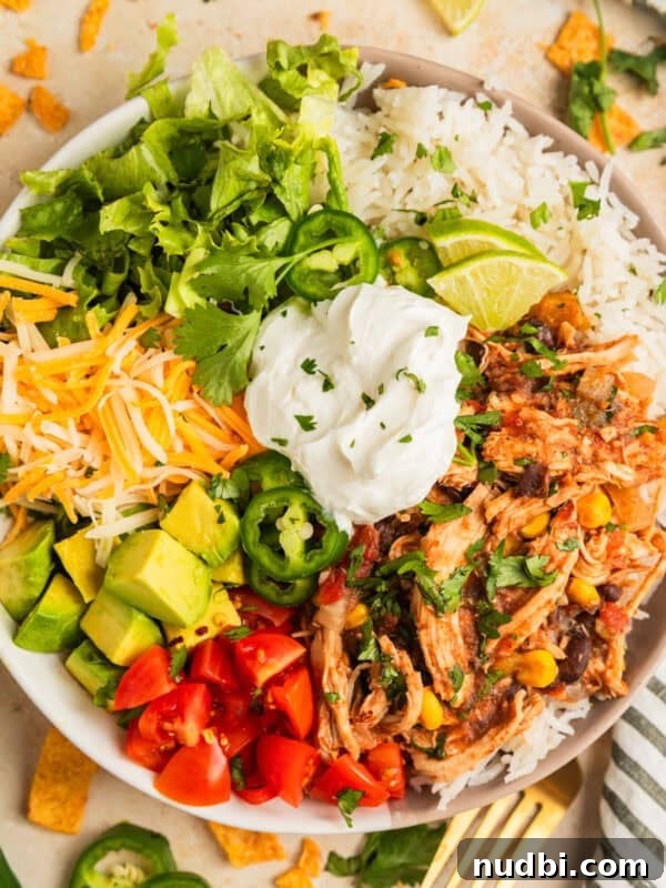 Slow-Cooker Orange Chicken Recipe for Tender, Saucy Chicken 15 Slow cooker chicken burrito bowl with rice, beans, corn, cheese, lettuce and more.